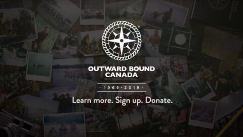 A photo of several people with the outward bound canada logo.