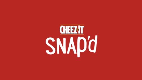 Logo of cheez-it snap’d on a red background, featuring white and yellow lettering.